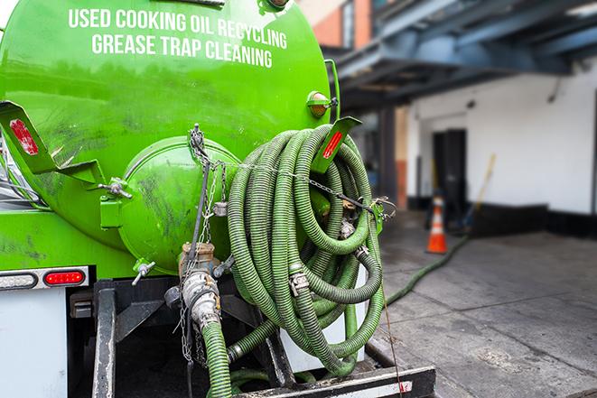 a pump truck emptying a grease trap in Beckemeyer